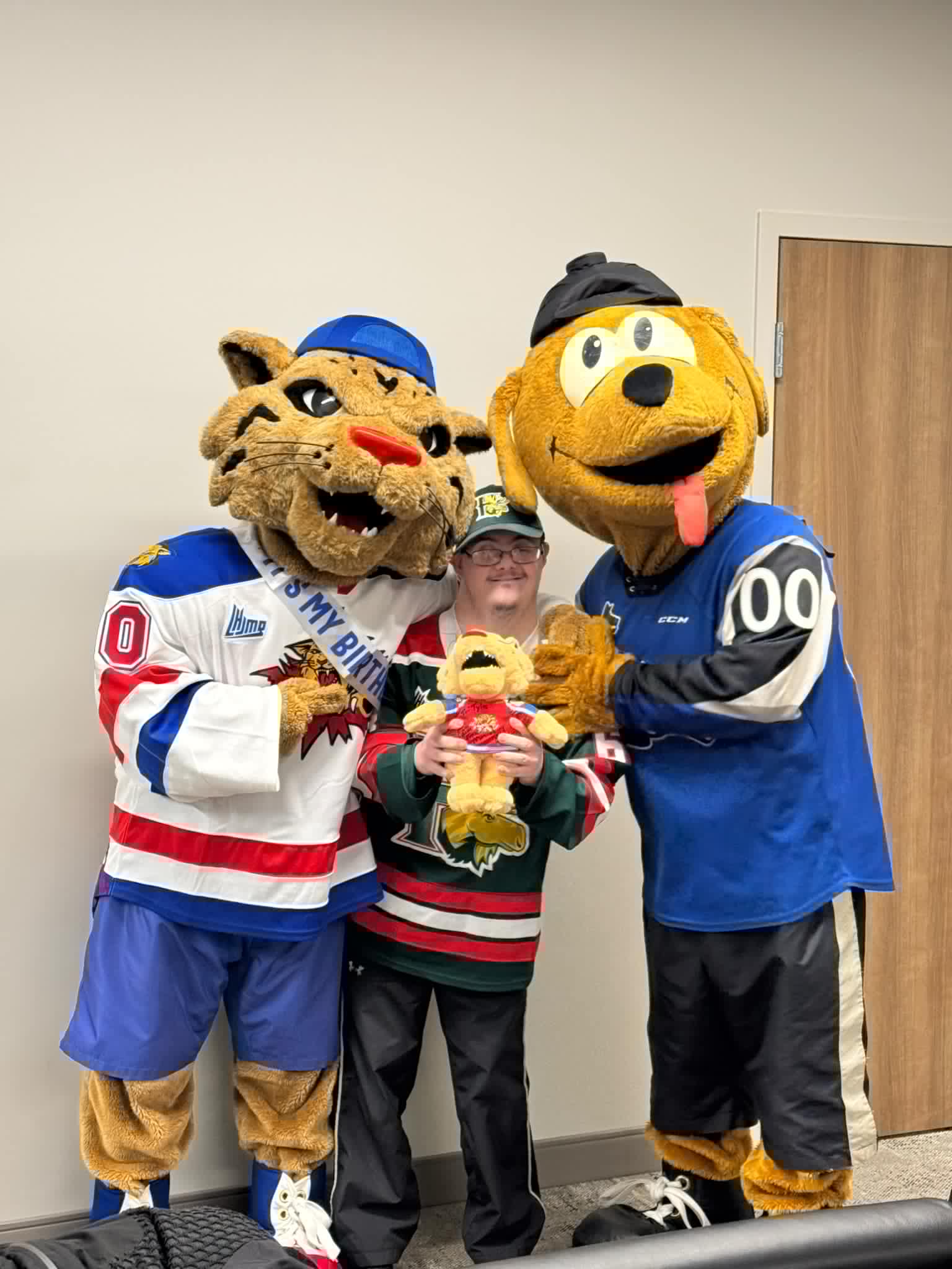 Tyler with hockey mascots