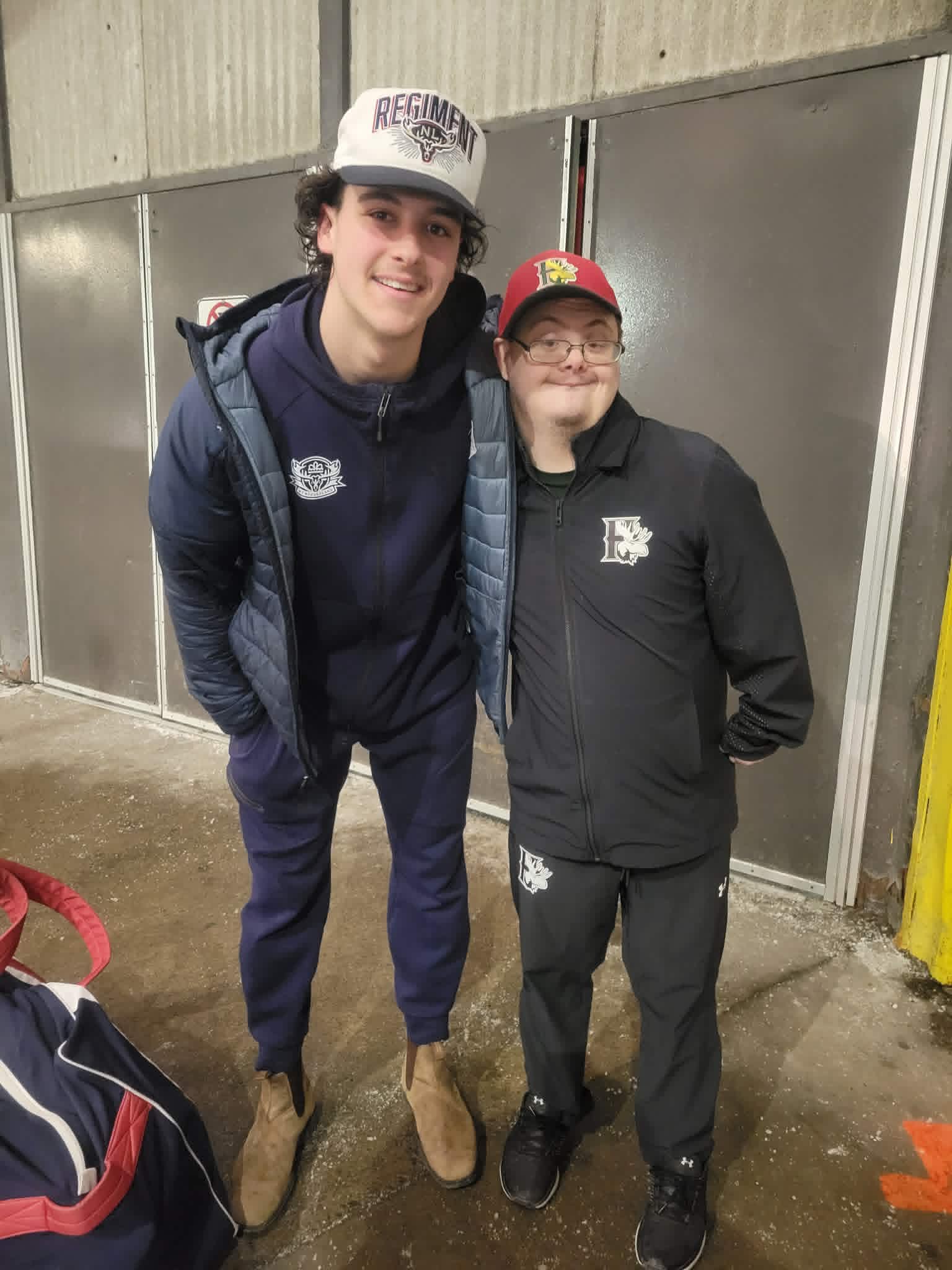Tyler with a hockey player